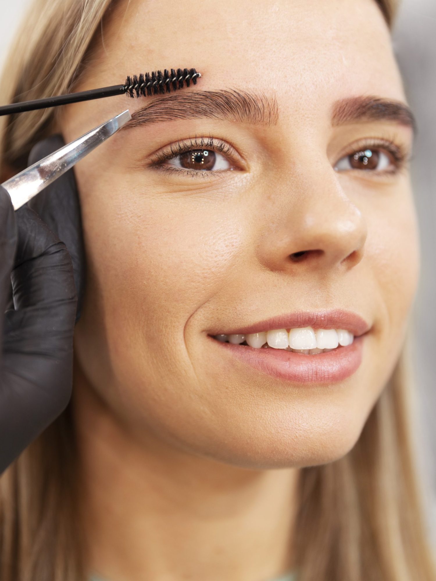 beautiful-young-woman-going-through-microblading-treatment