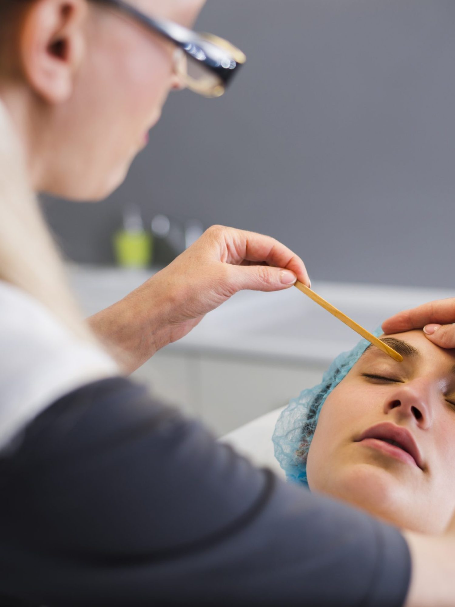 girl-receiving-facial-treatment-in-a-beauty-salon